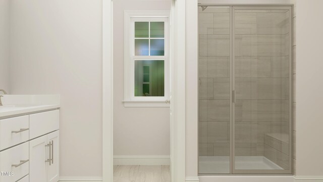 880 Cassa Clubhouse Way, Knightdale, NC 27545 - bathroom with vanity, baseboards, a stall shower, and marble look tiles