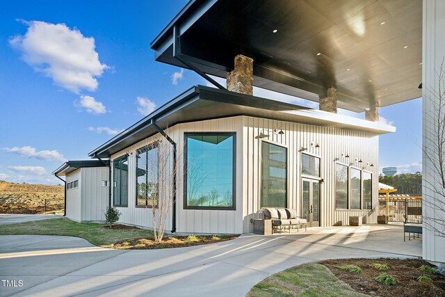 880 Cassa Clubhouse Way, Knightdale, NC 27545 - view of property exterior featuring a patio area