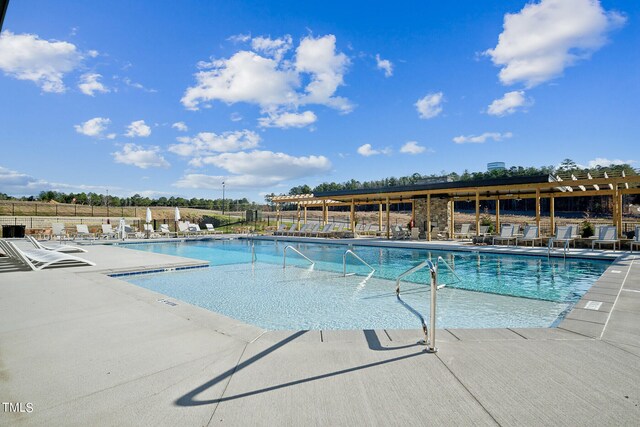 880 Cassa Clubhouse Way, Knightdale, NC 27545 - community pool with a patio area