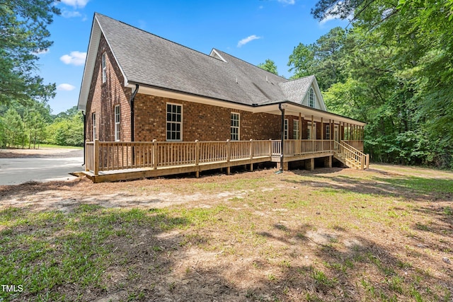 2015 Saddlebrook Dr, Archer Lodge, NC 27527 - rear view of property with roof with shingles, a porch, and brick siding