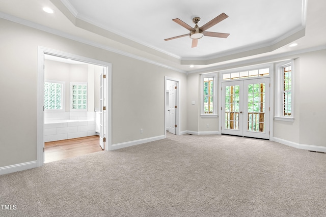 2015 Saddlebrook Dr, Archer Lodge, NC 27527 - unfurnished room with carpet, a tray ceiling, ornamental molding, ceiling fan, and baseboards