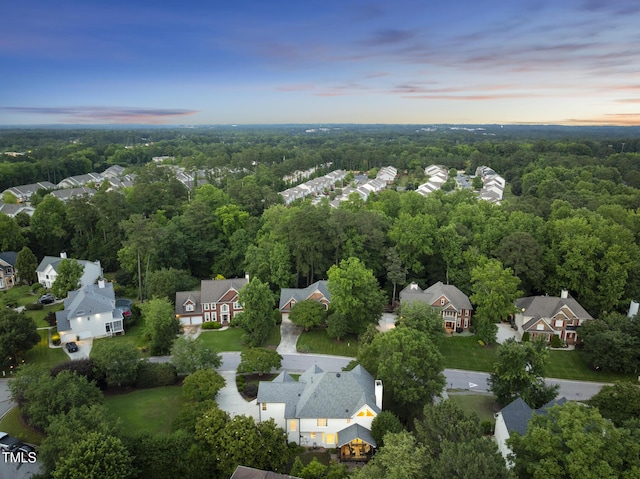 704 Walcott Way, Cary, NC 27519 - aerial view at dusk of a residential view and a forest view
