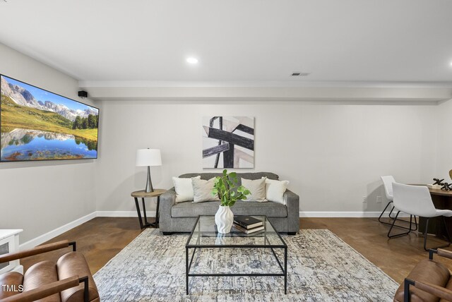 704 Walcott Way, Cary, NC 27519 - living room featuring concrete flooring, baseboards, and recessed lighting