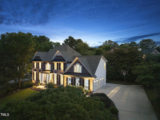 704 Walcott Way, Cary, NC 27519 - colonial home with driveway, a standing seam roof, and metal roof