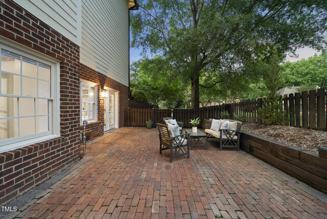 704 Walcott Way, Cary, NC 27519 - fenced backyard featuring an outdoor living space and a patio area