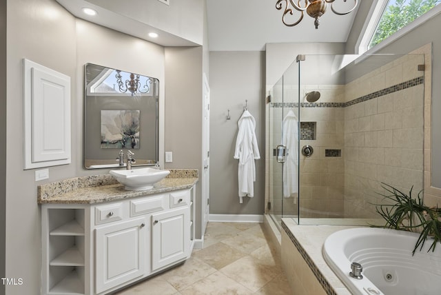 704 Walcott Way, Cary, NC 27519 - full bathroom with a shower stall, a jetted tub, vanity, and baseboards