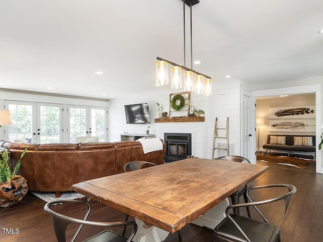 1625 Haystack Ln, Burlington, NC 27217 - dining area featuring hardwood / wood-style floors, a glass covered fireplace, french doors, and recessed lighting