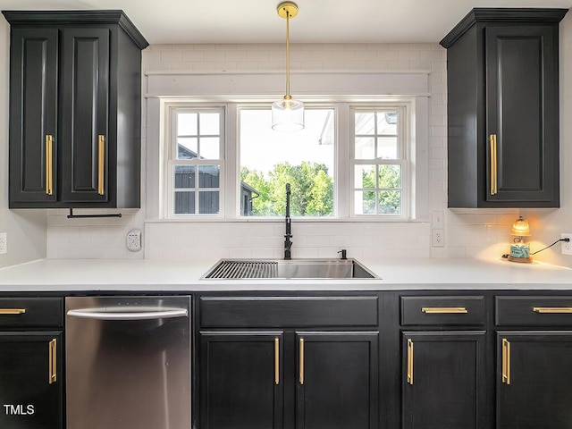 1625 Haystack Ln, Burlington, NC 27217 - kitchen with stainless steel dishwasher, a sink, dark cabinets, backsplash, and light countertops