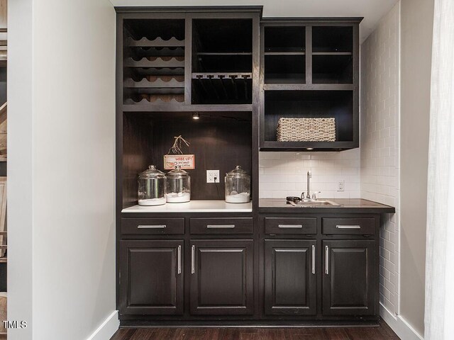 1625 Haystack Ln, Burlington, NC 27217 - indoor wet bar featuring baseboards, dark wood-type flooring, and tasteful backsplash