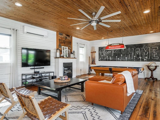 1625 Haystack Ln, Burlington, NC 27217 - living room with wood ceiling, a wall mounted AC, wooden walls, a ceiling fan, and wood-type flooring