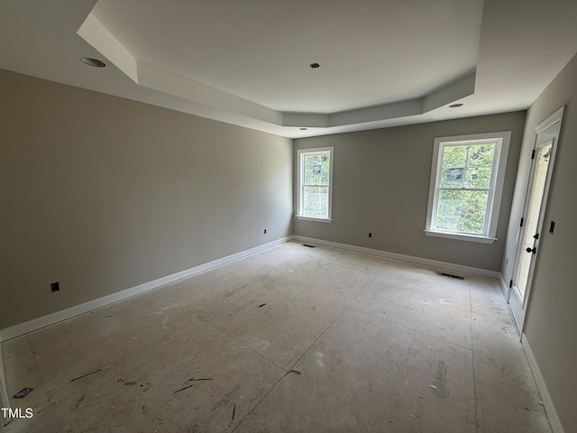2744 Rains Mill Rd, Princeton, NC 27569 - spare room with a raised ceiling and baseboards