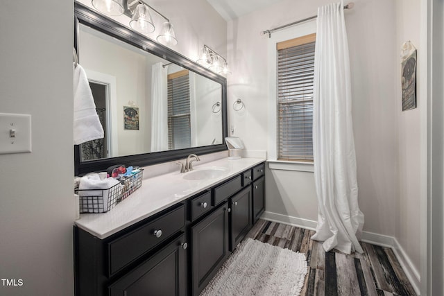 4409 All Points View Way, Raleigh, NC 27614 - bathroom featuring wood finished floors, vanity, and baseboards