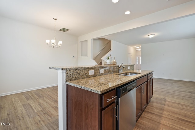 72 S Grey Abbey Dr, Clayton, NC 27527 - kitchen featuring stainless steel dishwasher, a sink, light wood-style flooring, baseboards, and recessed lighting