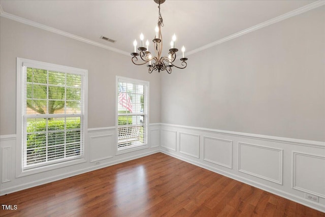 404 Straywhite Ave, Apex, NC 27539 - empty room with a chandelier, ornamental molding, wood finished floors, and a wainscoted wall