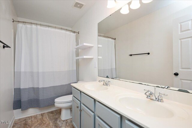 404 Straywhite Ave, Apex, NC 27539 - full bath with double vanity, toilet, and a shower with shower curtain