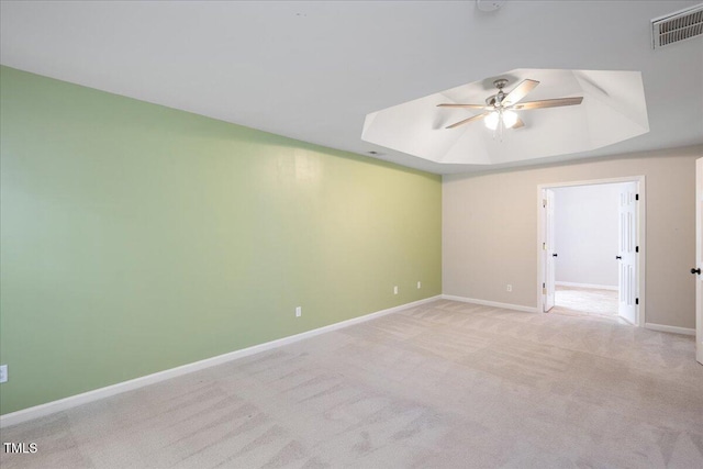 404 Straywhite Ave, Apex, NC 27539 - carpeted spare room featuring ceiling fan, a tray ceiling, and baseboards