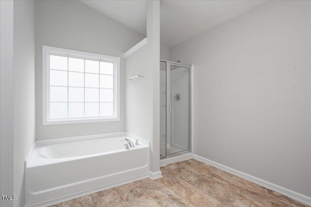 404 Straywhite Ave, Apex, NC 27539 - bathroom featuring a garden tub, a shower stall, and baseboards