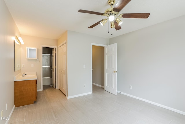 96 Landmark Dr, Angier, NC 27501 - unfurnished bedroom featuring baseboards, a closet, a ceiling fan, and a sink