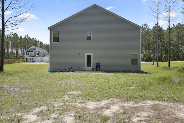 124 Teagarden Ct, Sanford, NC 27332 - rear view of property with a yard