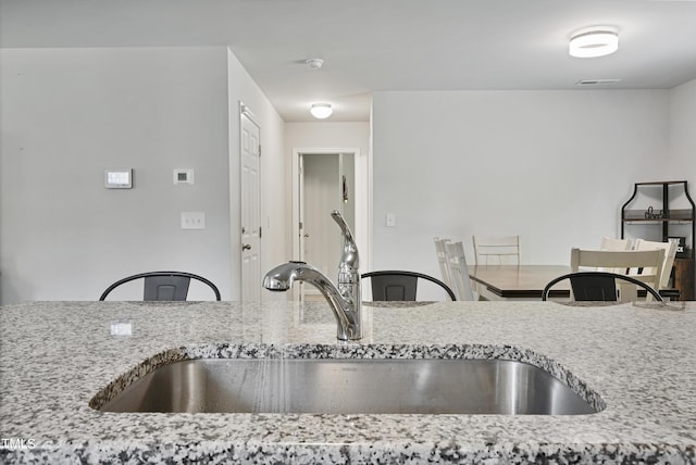124 Teagarden Ct, Sanford, NC 27332 - kitchen with a sink and light stone countertops