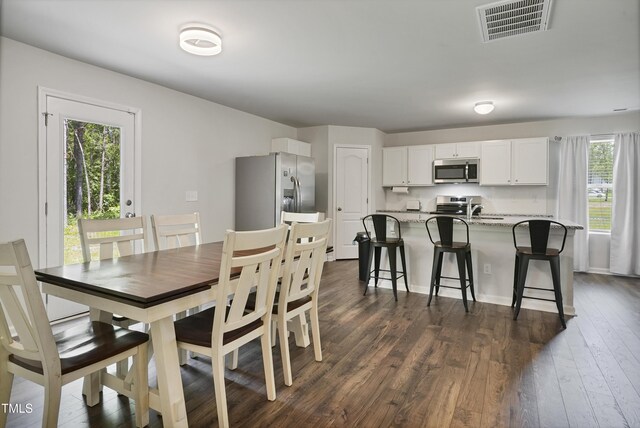 124 Teagarden Ct, Sanford, NC 27332 - dining area with dark wood-style flooring