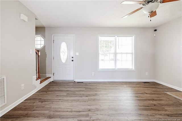 1414 Seabiscuit Dr, Parkton, NC 28371 - foyer entrance with ceiling fan, wood finished floors, and baseboards