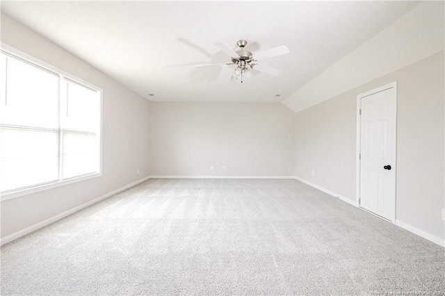 1414 Seabiscuit Dr, Parkton, NC 28371 - empty room with light colored carpet, a ceiling fan, baseboards, and vaulted ceiling