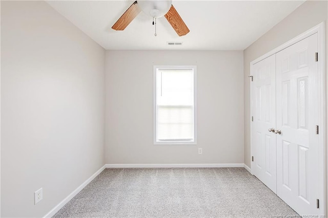 1414 Seabiscuit Dr, Parkton, NC 28371 - unfurnished bedroom with baseboards, carpet, a closet, and a ceiling fan