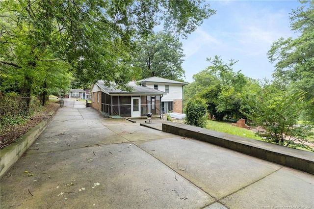 830 Edenwood Dr, Fayetteville, NC 28303 - view of front of home featuring a sunroom and driveway