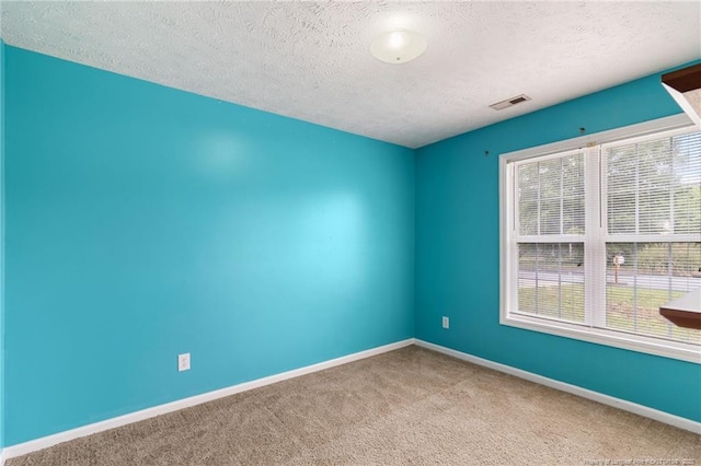 225 Northwoods Dr, Raeford, NC 28376 - carpeted spare room featuring a textured ceiling and baseboards