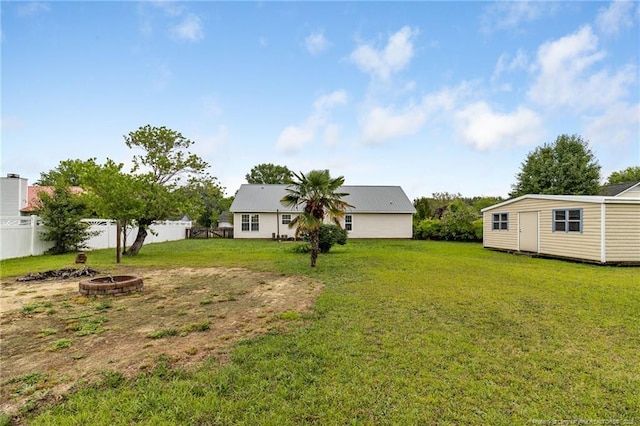 225 Northwoods Dr, Raeford, NC 28376 - view of yard featuring an outdoor fire pit and an outdoor structure