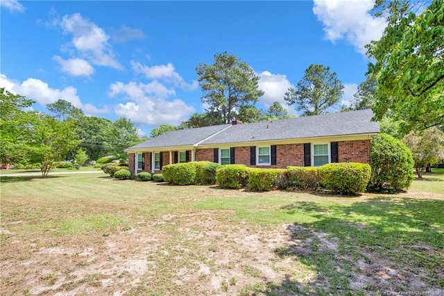 500 Cecil St, Fayetteville, NC 28312 - ranch-style home with brick siding, a front yard, and a chimney