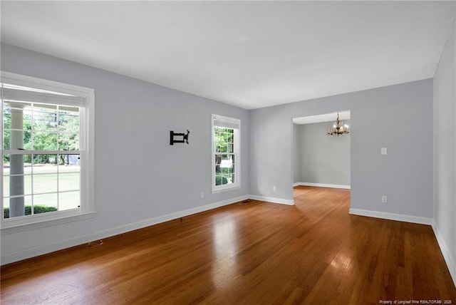 500 Cecil St, Fayetteville, NC 28312 - empty room featuring a chandelier, wood finished floors, and baseboards