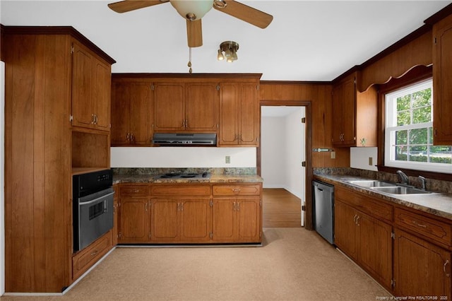 500 Cecil St, Fayetteville, NC 28312 - kitchen with wall oven, a sink, dishwasher, under cabinet range hood, and brown cabinets