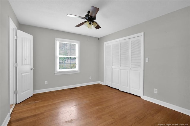 500 Cecil St, Fayetteville, NC 28312 - unfurnished bedroom featuring wood finished floors, baseboards, and a closet
