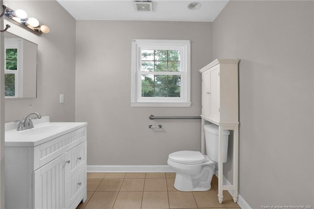 500 Cecil St, Fayetteville, NC 28312 - bathroom featuring baseboards, vanity, toilet, and tile patterned flooring