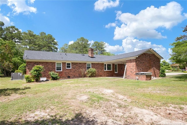 500 Cecil St, Fayetteville, NC 28312 - back of property featuring brick siding, a yard, a chimney, and crawl space