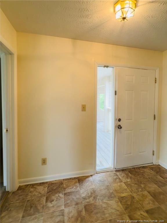 661 Bartons Landing Pl Unit 9, Fayetteville, NC 28314 - foyer with baseboards and stone finish flooring