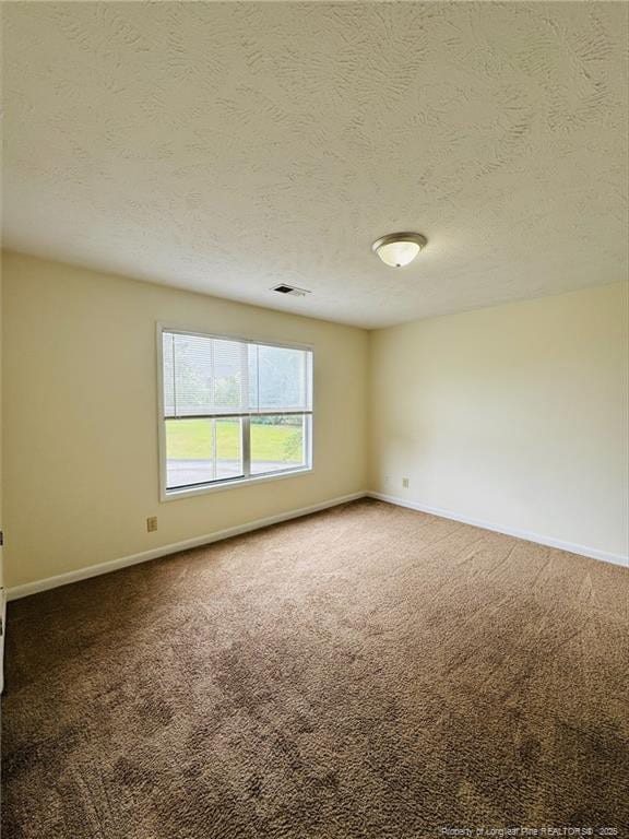 661 Bartons Landing Pl Unit 9, Fayetteville, NC 28314 - carpeted empty room with a textured ceiling and baseboards