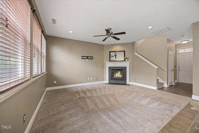132 Ryder Cup Cir, Raleigh, NC 27603 - unfurnished living room featuring stairs, healthy amount of natural light, a fireplace with flush hearth, a ceiling fan, and recessed lighting