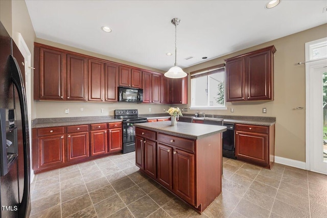 132 Ryder Cup Cir, Raleigh, NC 27603 - kitchen with black appliances, healthy amount of natural light, dark brown cabinets, hanging light fixtures, and recessed lighting
