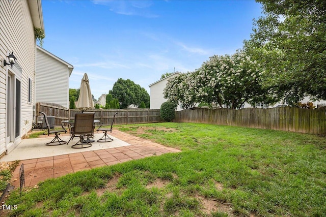 132 Ryder Cup Cir, Raleigh, NC 27603 - fenced backyard featuring a patio
