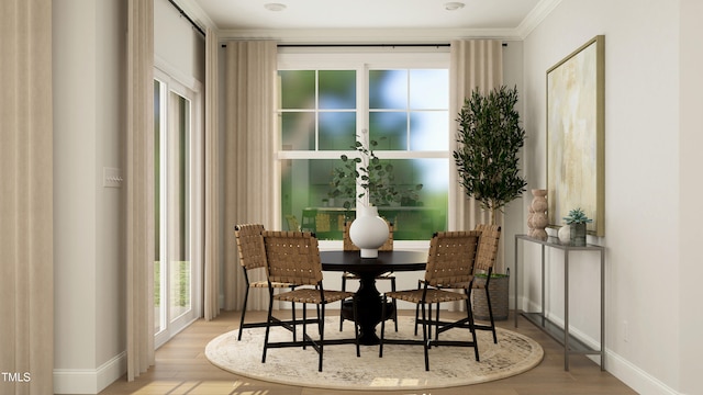 945 Cassa Clubhouse Way, Knightdale, NC 27545 - dining room with wood finished floors, crown molding, and baseboards