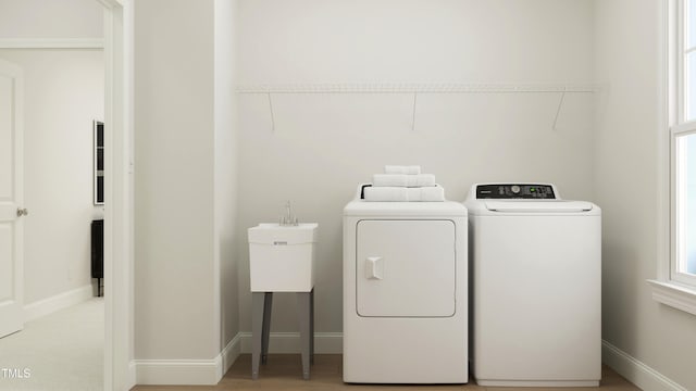 945 Cassa Clubhouse Way, Knightdale, NC 27545 - laundry area with baseboards and independent washer and dryer