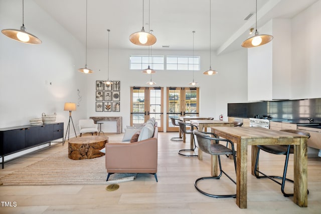 945 Cassa Clubhouse Way, Knightdale, NC 27545 - living area with a towering ceiling and light wood finished floors