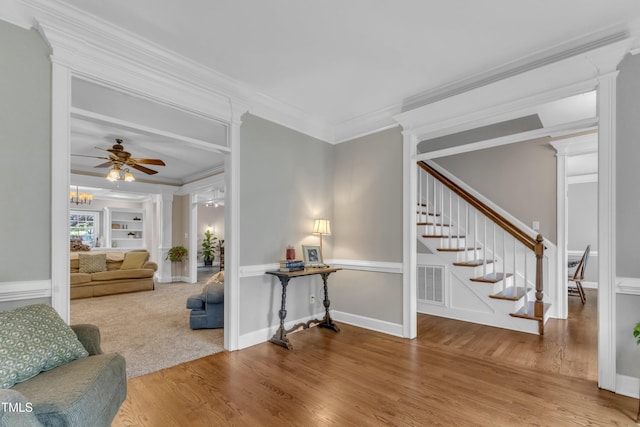 4620 Gomar Ln, Fuquay Varina, NC 27526 - living room with wood finished floors, crown molding, stairway, and ceiling fan