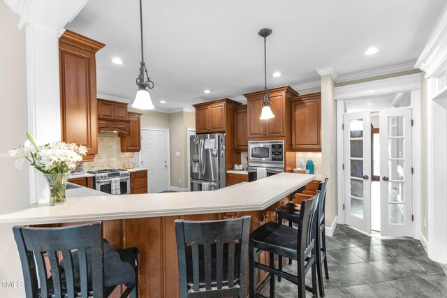 4620 Gomar Ln, Fuquay Varina, NC 27526 - kitchen with stainless steel appliances, recessed lighting, light countertops, brown cabinetry, and decorative backsplash