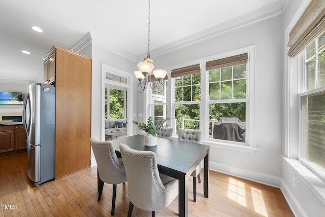 106 Painted Turtle Ln, Cary, NC 27519 - dining room with ornamental molding, light wood-style floors, a chandelier, baseboards, and recessed lighting