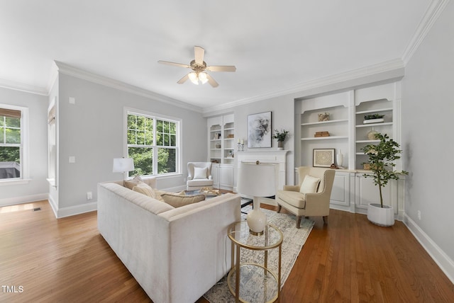 106 Painted Turtle Ln, Cary, NC 27519 - living area with healthy amount of natural light, ceiling fan, light wood-style flooring, baseboards, and crown molding
