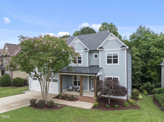 106 Painted Turtle Ln, Cary, NC 27519 - view of front of property with driveway, a porch, a standing seam roof, and a front yard